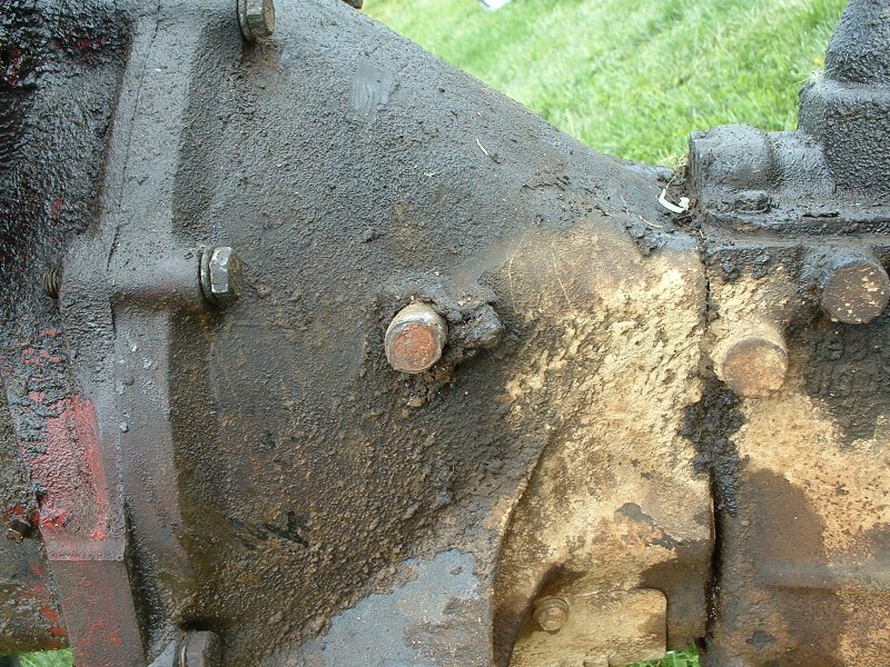 view of damaged shaft with the transmission/bellhousing out of the truck